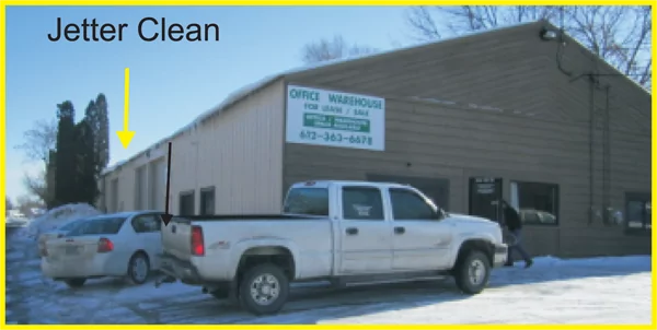 Jetter Clean Lakeville technician garage with pickup in front.